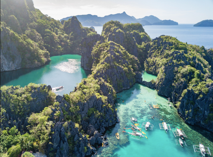 A view of water and a mountain in the background
Description automatically generated