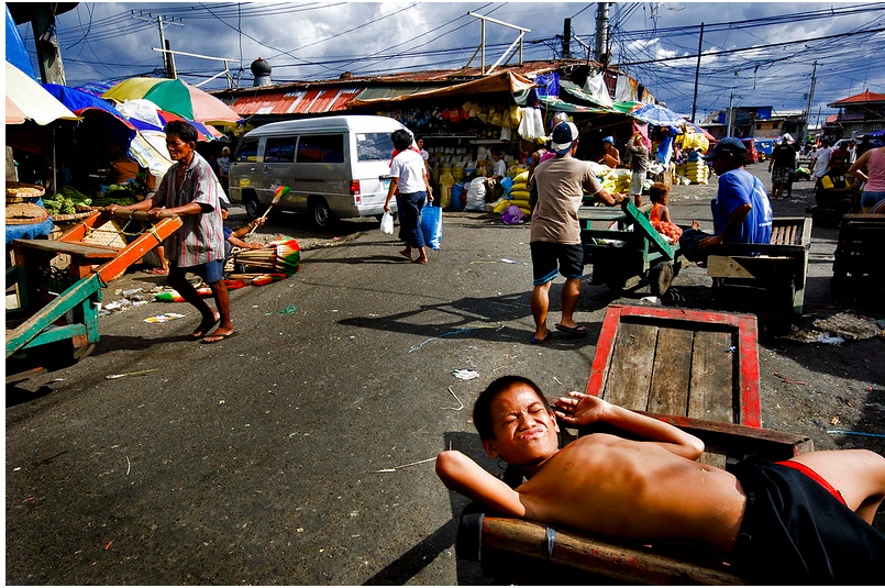 A group of people sitting in front of a crowd
Description automatically generated