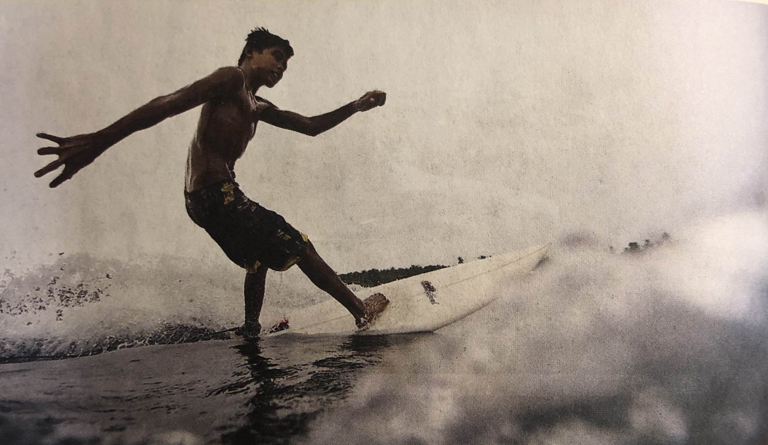 A picture containing outdoor, man, sport, surfing
Description automatically generated