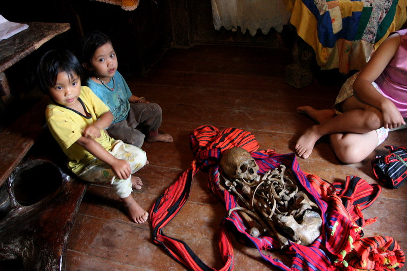 A person sitting on a table
Description automatically generated